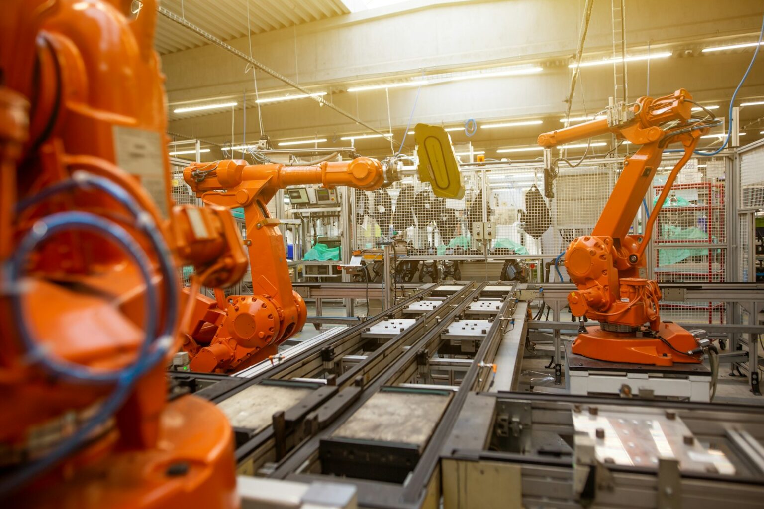 소프트뱅크와 엔비디아, 스킬드 AI에 10억 달러 투자 논의 a factory filled with lots of orange machines