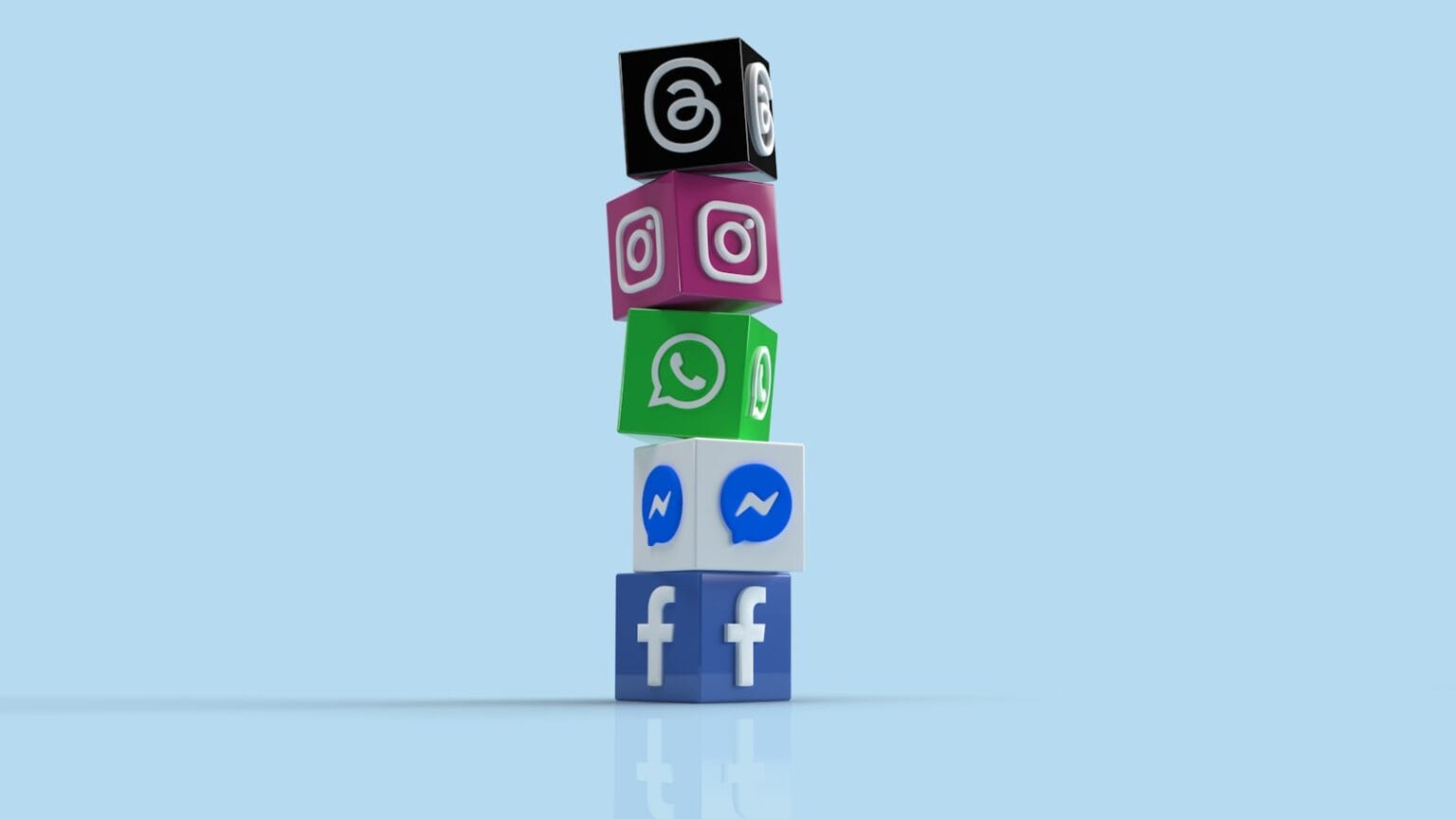 메타, 인스타-페북-왓츠앱 유료 구독 ‘메타 원’ 출시 a stack of colorful blocks with social icons on them
